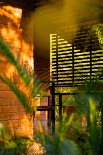 a bench sitting in front of a brick wall at Safari Lodge Yala in Kataragama
