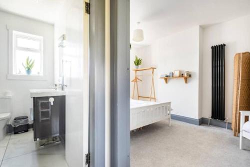 a bathroom with a sink and a bath tub at Cosy Hygge/ Scottish themed home by Loch Ness in Fort Augustus