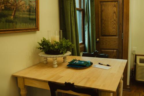 a wooden table with a plant on top of it at Landoll's Mohican Castle in Loudonville