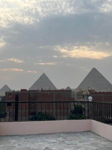 a view of the pyramids from a balcony at Badr pyramids inn in Cairo