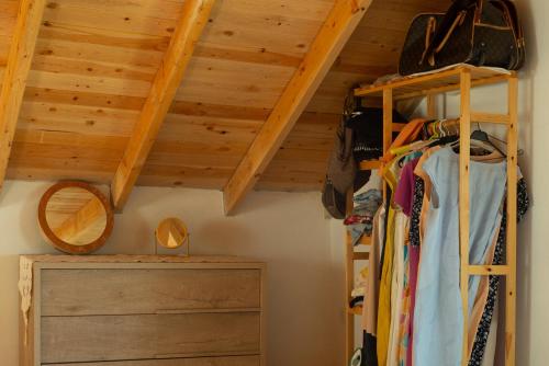 a bedroom with wooden ceilings and a bunk bed at Masal Evimiz in Antalya