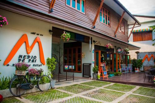 a mcdonalds restaurant with a bike parked outside of it at Medio De Pai in Pai