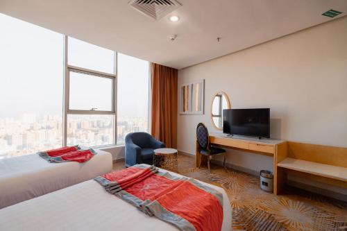 Katil atau katil-katil dalam bilik di Wahaj Hotel Apartments 2