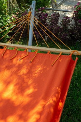 an orange blanket is hanging on a stick at Masal Evimiz in Antalya