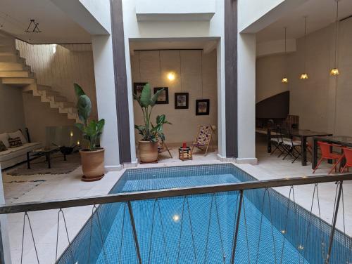 a house with a swimming pool in a room at Dar d'Art in Marrakech