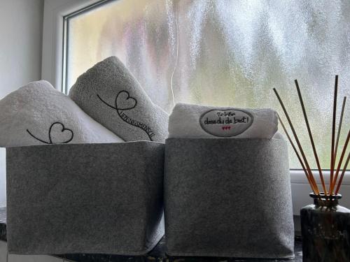 a pair of towels sitting in front of a window at Schöne Eigentumswohnung in Kassel in Kassel