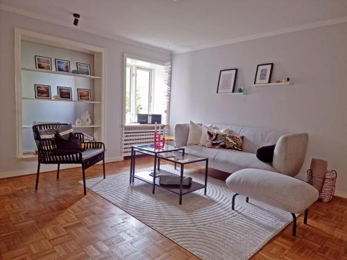 a living room with a couch and a table at Kieler Eiderparadies in Flintbek