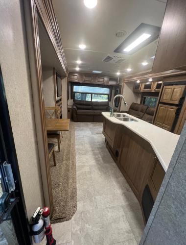 an interior view of an rv kitchen with a sink at Sunrise Hideaway in Crystal River