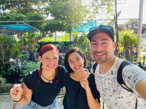 a man and two women posing for a picture at Hà Trang Homestay in Nghĩa Lộ