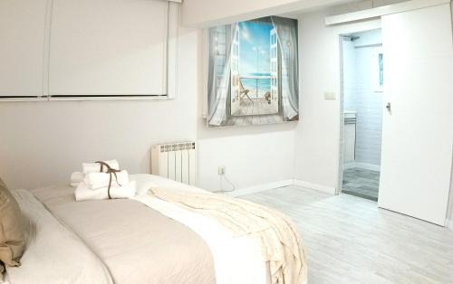 Ένα ή περισσότερα κρεβάτια σε δωμάτιο στο Alojamiento Casamar, con jardín