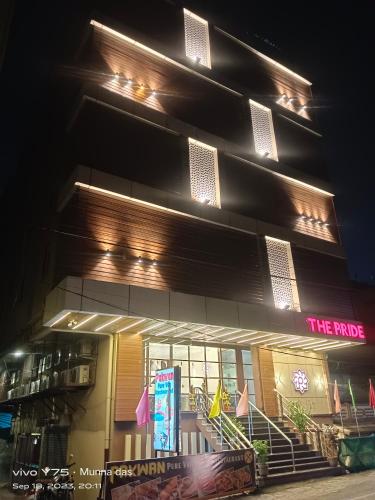 a building with a sign in front of it at night at The Pride in Jamshedpur