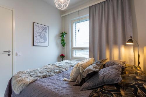 Postel nebo postele na pokoji v ubytování Tuomas´ luxurious suites, Soilu
