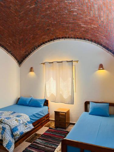 Postel nebo postele na pokoji v ubytování Magic land taba camp