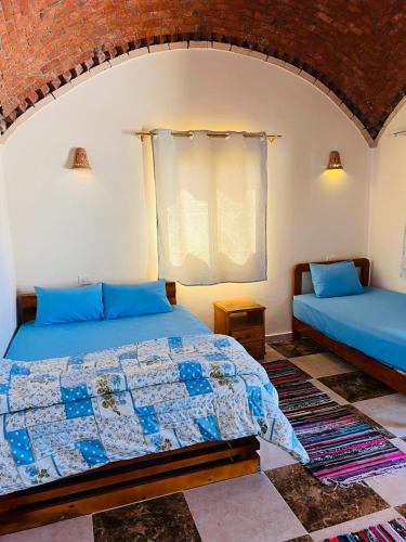 Postel nebo postele na pokoji v ubytování Magic land taba camp