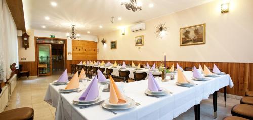 a row of tables with paper boats on them at Rooms Pevc & Hostel Ljubno ob Savinji in Ljubno