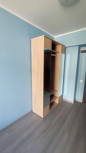 an empty room with a cupboard in the middle of it at Burtnieku 33 in Rīga
