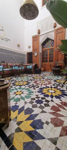 a lobby with a checkered floor in a building at Riad Fes Touria Palace in Fès