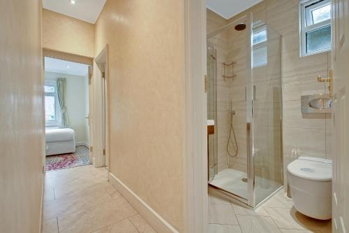 a bathroom with a toilet and a shower at Noel Road in London