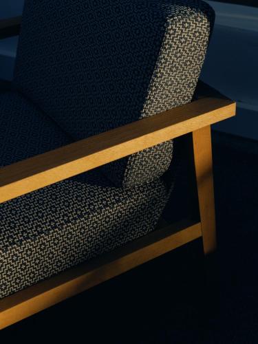 a close up of a chair with a wooden bench at Mondrian Ibiza in Cala Llonga