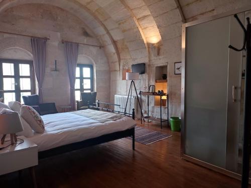 Postel nebo postele na pokoji v ubytování Rivendell Cappadocia