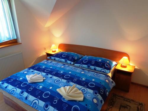 Posteľ alebo postele v izbe v ubytovaní Penzion Centrum