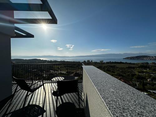 a balcony with a view of the water at La Vista Luxury Villa in Ohrid