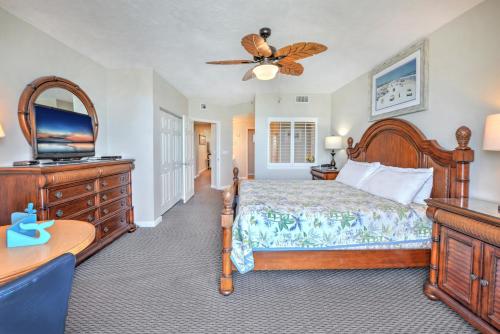 a bedroom with a bed and a flat screen tv at Wyndhams Ocean Walk Resort in Daytona Beach
