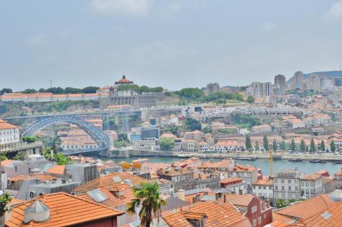 a view of a city with a river and buildings at PipaD'oro by YoursPorto in Porto