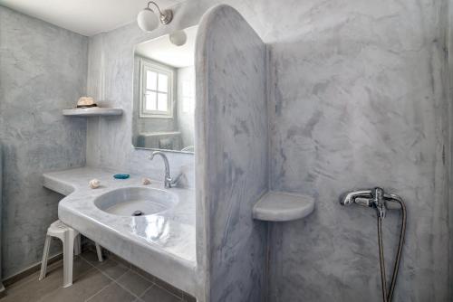 a bathroom with a sink and a mirror at Monolithia in Kamari