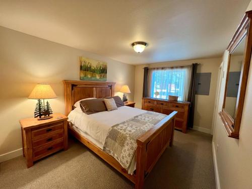a bedroom with a large bed and a window at Great downtown Sandpoint location! in Sandpoint