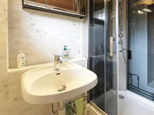 a bathroom with a sink and a shower at 8 person holiday home in ULRIKA-By Traum in Rimforsa
