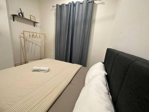מיטה או מיטות בחדר ב-Mid Valley Luxury Style Suites 谷中城奢华风格套房