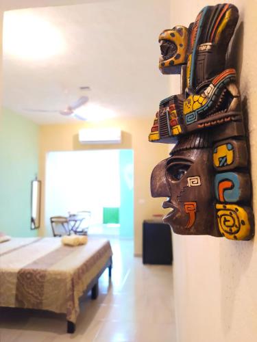 a mask hanging on a wall in a room at Casa Candelita in Valladolid