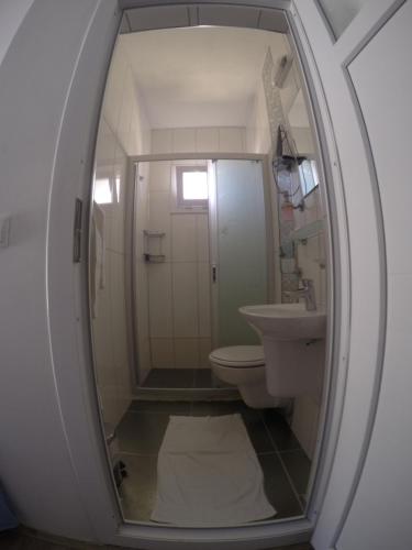 a bathroom with a toilet and a sink at Akkin Pansiyon in Kaş