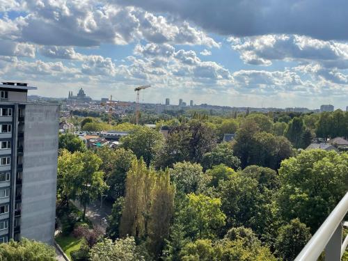 a view of the city from a building at Furnished - Bright, Modern apartment in Brussels, 15 minutes walk from the Atomium in Brussels