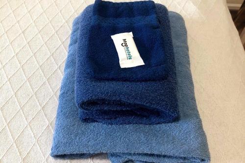 a blue towel sitting on top of a table at Garden room - view of nature in Evilard