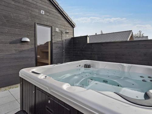 a large bath tub sitting on top of a building at Luxury Retreat with Pool - By Traum Ferienwohnungen in Kongsmark