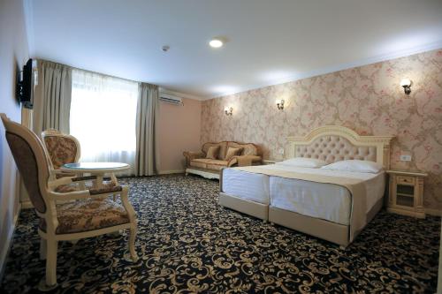 En eller flere senger på et rom på Hotel Orient Braila