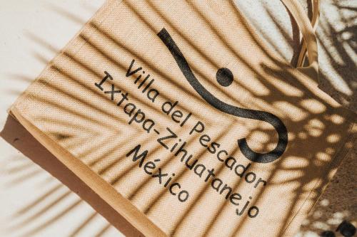 a piece of paper with writing on it at Villa del Pescador in Zihuatanejo