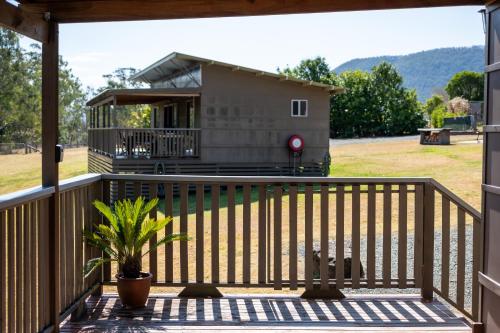 a view of a house from the deck of a house at Barrington Riverside Cottages in Barrington