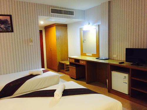 Postel nebo postele na pokoji v ubytování Natural Samui Hotel