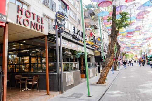 a street with a hotel kokonee on a city street at Konur Hotel in Ankara