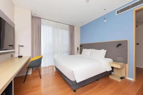 Postel nebo postele na pokoji v ubytování Holiday Inn Express Beijing Yizhuang Tongming Lake By IHG