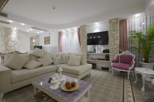 a living room with a couch and a table at Cella Hotel & SPA Ephesus in Selcuk