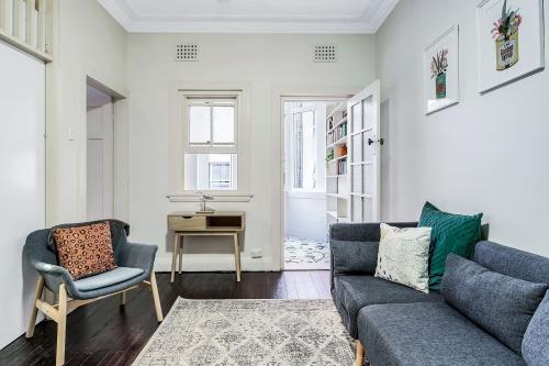 a living room with a couch and two chairs at Coogee Classic - Coastal Gem Close to Beach in Sydney