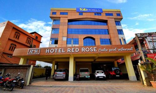 a hotel red ridge with cars parked in front of it at FabHotel RR Suites Guwahati in Guwahati