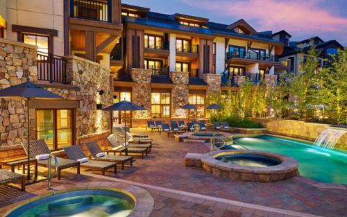 a resort with a swimming pool and a building at The Sebastian, Vail Village in Vail