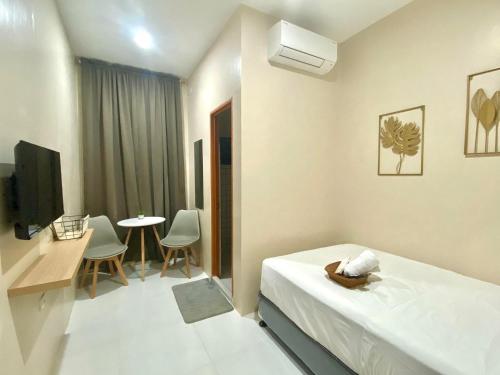 TV a/nebo společenská místnost v ubytování Torres Traveller's Inn