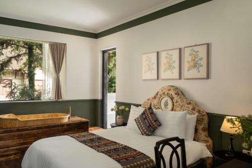 Postel nebo postele na pokoji v ubytování The Gate Boutique Hotel Sapa