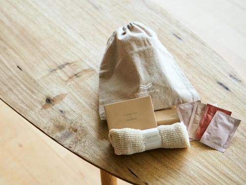 a table with a bandage and a bag on it at YANMAR SUNSET MARINA CLUBHOUSE&HOTEL in Moriyama